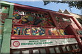 View of shops decorated for the London Mural Festival on Aberfeldy Street #12