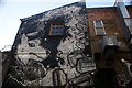 View of a mural on the rear of shops on Brick Lane #2