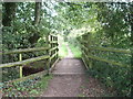 A new wooden bridge over an old brick bridge