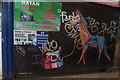 View of street art on the side of Rayan Internet Shop from Symes Mews