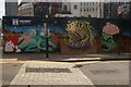 TQ3182 : View of a mural on a construction hoarding on Great Sutton Street from Goswell Road #2 by Robert Lamb