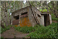 NH8067 : Old Pill Box in the Woods at South Sutor, Ross-shire by Andrew Tryon