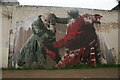 View of a mural on the rear of an electricity station on Ray Dudley Way