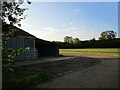 Farm building and woodland strip