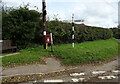 Elizabeth II postbox and fingerpost on The Street, Hindringham