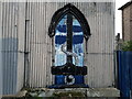 View of street art on a window of the Tin Tabernacle on Cambridge Avenue