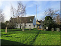TL4945 : Hinxton: churchyard and church gate by John Sutton