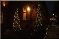 View of Christmas trees in the garden of The Sloane Club from Lower Sloane Street