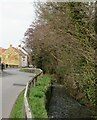 Beck and road at the south end of Swainby