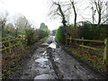 Muddy track to dwellings