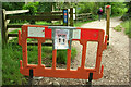 SX7961 : Covid notice on barrier near Dartington Lodge by Derek Harper