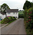 House alongside a bend in the road near Llanddewi Rhydderch, Monmouthshire 