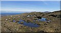 NG0391 : Boggy pools on the eastern slopes of Bleabhal, Harris by Claire Pegrum