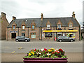 NH5250 : Shops on Great North Road, Muir of Ord  by Stephen Craven