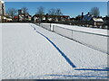 Shadow of tennis net on fresh snow