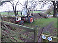 Old tractor beside the footpath