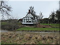 Half-timbered house above the river at Cound