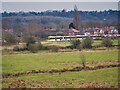 Metrolink Tram passing Houses at Bank Top