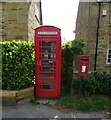 Elizabeth II postbox and telephone box on the B1363, Brandsby