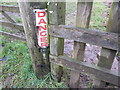 Old signage on a repurposed telegraph pole, now a gatepost