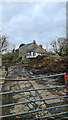 Manure Pile with Farmhouse behind