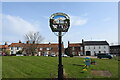 TF9129 : Hempton village sign by Adrian S Pye