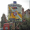 TF9734 : Thursford village sign (west face) by Adrian S Pye