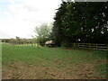 Grass field and old water carrier near White Lodge