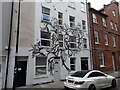 View of street art on the front of a house on Turville Street