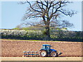 Tractor ploughing in Spring near Acton Burnell