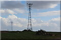 Tall electricity pylons either side of the River Usk