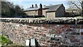 Brick wall bounding Harker Lodge on west side of A7