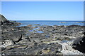 NJ8864 : Tidal rocks, Aberdour Bay by Bill Harrison