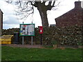 Elizabeth II postbox and notice board on Leagarth Lane, Hilton