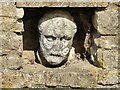 SP0936 : Carved head in a wall by Philip Halling