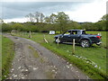 Abandoned pickup truck, caravan and garage in the field