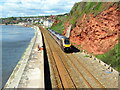 SX9777 : Cross Country train about to pass under footbridge near Dawlish by Roy Hughes