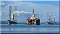 NH7968 : Oil rigs in Cromarty Firth by Graham Hogg