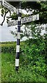 Cumberland County Council finger signpost at rural road junction west of Wide Open Dykes