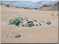 NK1057 : Marine rubbish on the beach at Rattray Head by Oliver Dixon
