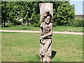 View of a wood carving of a runner in Mayesbrook Park