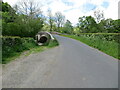 NY3438 : Hesket Bridge and road crossing the River Caldew by Peter Wood