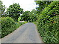 Minor road and bridge crossing the Hellifield to Clitheroe railway line