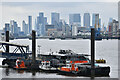 London seen beyond river ferry jetty at Woolwich