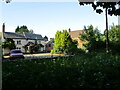 Houses beyond Langham Brook