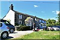 Bere Ferrers: Row of waterside cottages and a gentleman coming to launch his boat