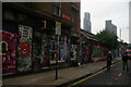 View of street art on the side of warehouse buildings on Sclater Street