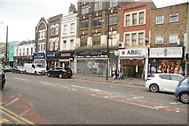 TQ3482 : View of shutter art on the front of Potty People on Bethnal Green Road by Robert Lamb