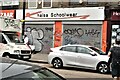 View of shutter art on the front of Khalsa Schoolwear on Bethnal Green Road