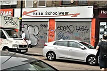 TQ3482 : View of shutter art on the front of Khalsa Schoolwear on Bethnal Green Road by Robert Lamb